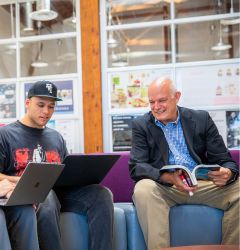 Mario Leone collaborating with a student